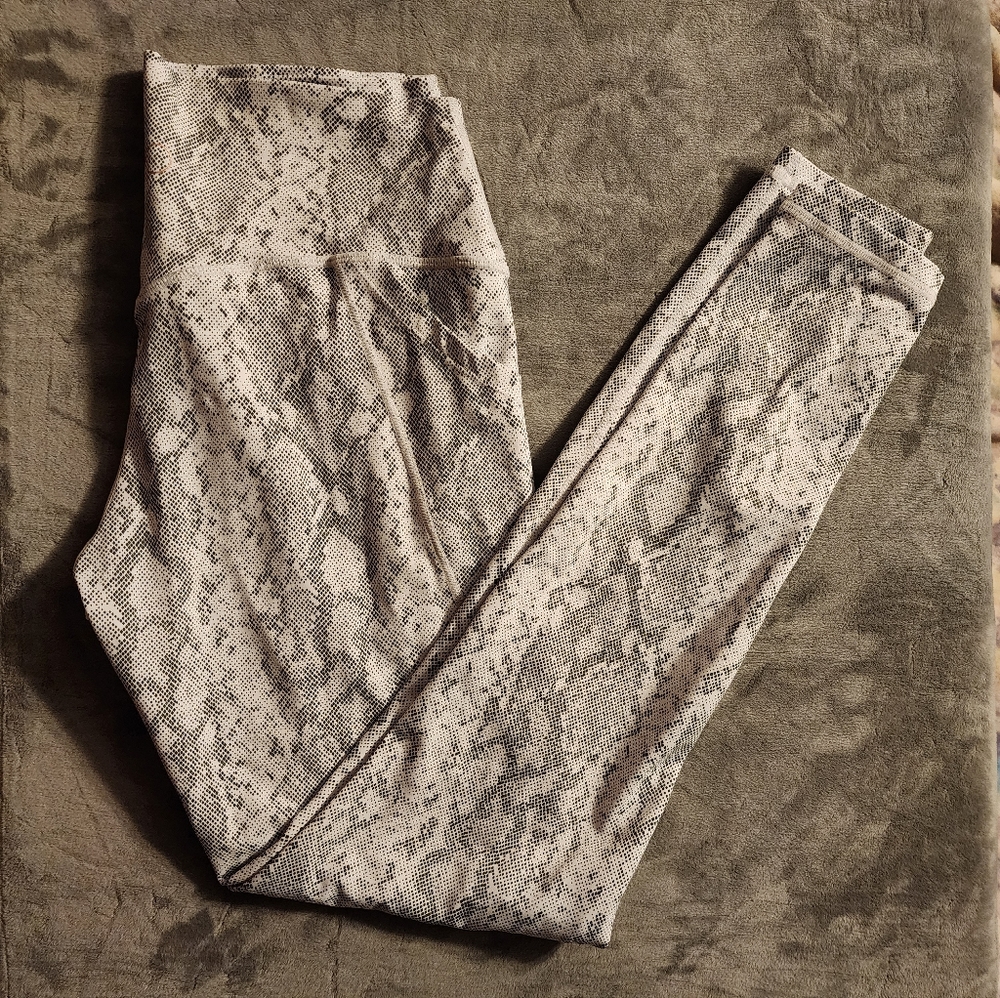 Set of Curves and Combatboots Snake print leggings and bra.